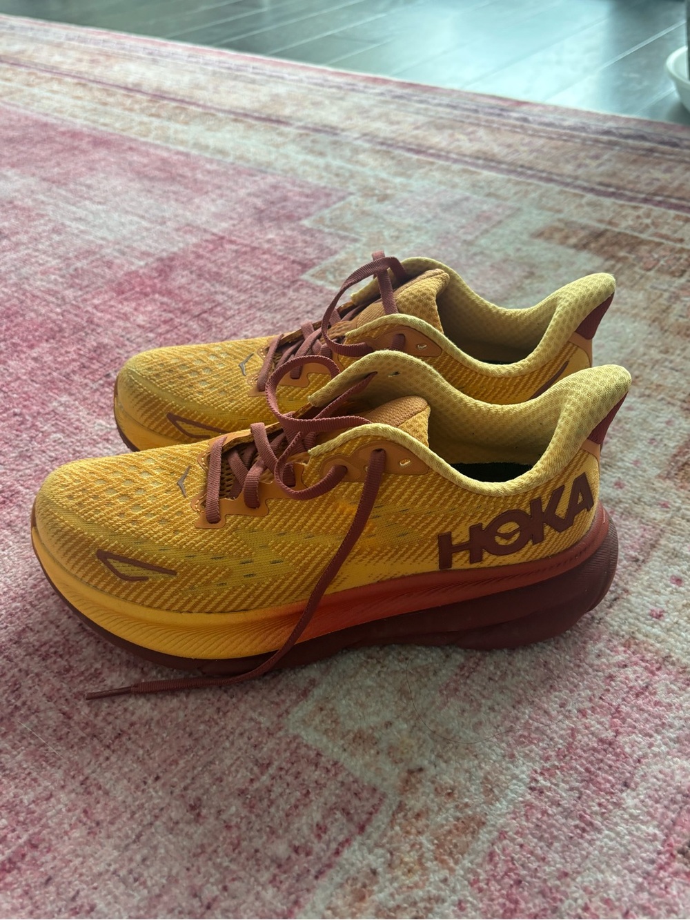 Hoka Yellow and Burgundy Neutral Running Shoes
